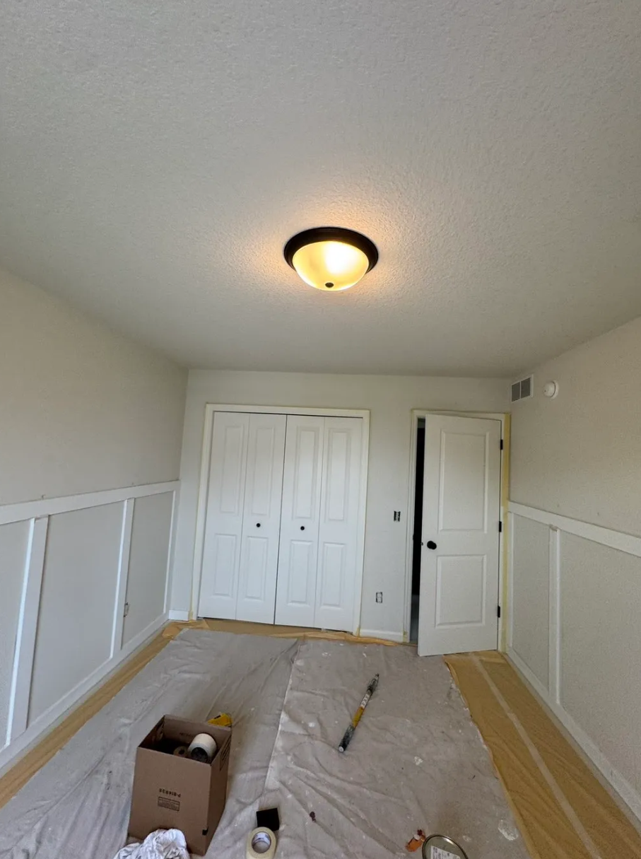 Interior bedroom painting — before with drop cloths